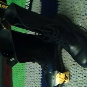 Worn once doc marten combat boots. Size 9 womans. Have new yellow laces and box